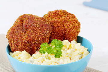 breaded burgers with potato salad