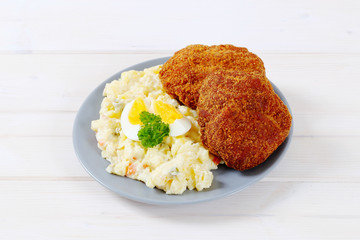 fried burgers with potato salad