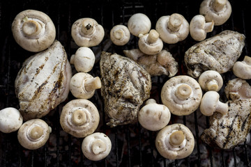 Hot Outdoor BBQ Grill With A Lot Of Mushrooms And Tasty Chicken Breast Meat