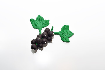 Black currant made from plasticine.