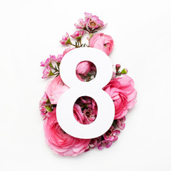 Layout with colorful flowers, leaves and number eight. Flat lay. Top view.