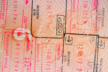 page in a foreign passport with stamps, background