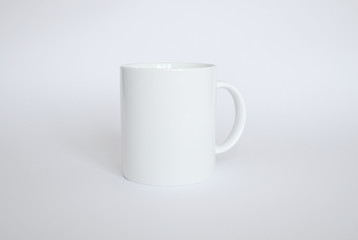 White mug on white background