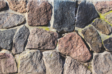 Fototapeta premium wall of large coarse stones, background texture