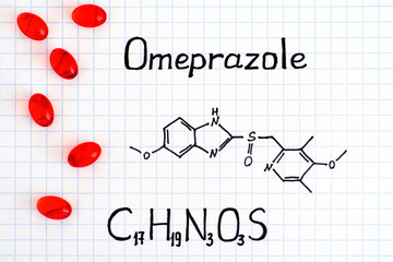 Chemical formula of Omeprazole with red pills.