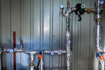 Side view of the glycol circuit pipelines of the industrial air conditioning system