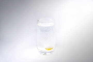 Vitamin C in glass with water. Abstract photo of healthy.