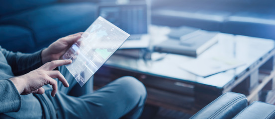 Man with futuristic digital tablet