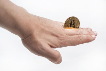 Abstract photo of cryptocyrrency. Some cryptocurrency coins in mans hand.