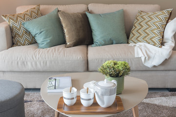 Fototapeta na wymiar cozy living room with sety of tea cup on table