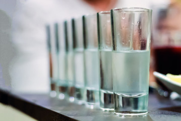 row of glasses for vodka shot