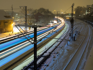 Light trail of a train at night in winter