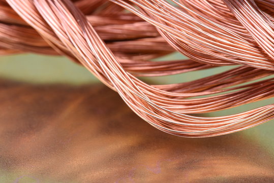 Copper wire raw materials and metals industry closeup on metal background