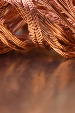 Copper wire on metal shiny surface 