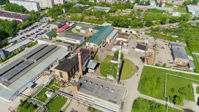 Oil Processing Departments against Distant Cityscape