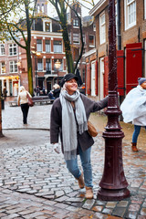 Young walks the streets of Amsterdam Amsterdam, Netherlands.