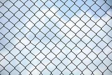Fototapeta premium cage metal net front the blue sky