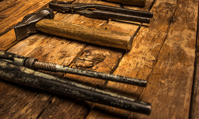 Wooden background with old work tools.