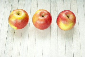 apples on white wooden table
