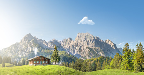 Chalet in front of mountains