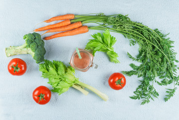 Smoothies and ingredients on a blue background with the top point