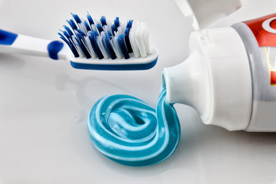 Toothpaste in a tube with a toothbrush