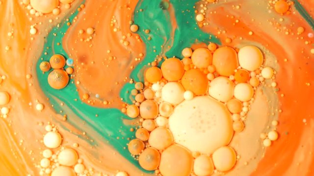 Ink Bubbles In Water. Orange Bubbles.Bright Collors Bubbles Oil Beautiful Paint Surface Red And Yellow Universe Of Color Moving Multicolored Macro.
