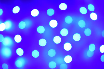 Blue illuminated background with different blurred tones, bokeh lights