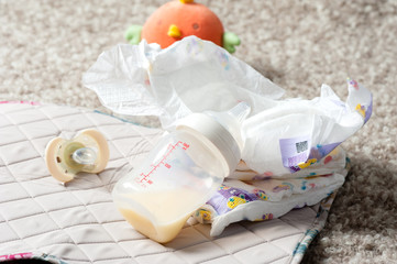 Baby bottle and disposable diapers