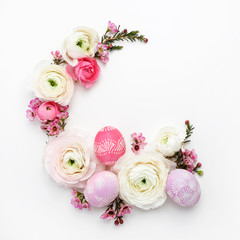 Circle border for easter card or invitation. Wreath with easter chicken eggs and ranunculus flowers.