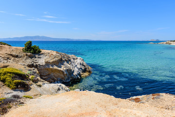 Fototapeta na wymiar Crystal clear sea water at Aliko beach on Naxos island. Cyclades, Greece