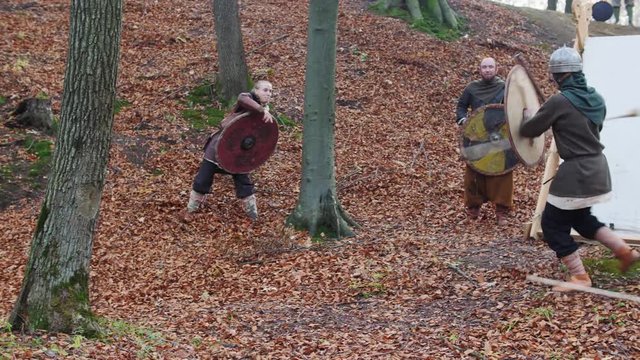 Warriors Vikings throws a spear in the battle. Preparing for battle.