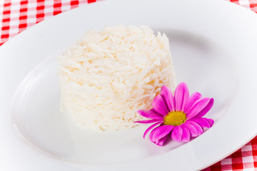 Obraz na płótnie Canvas Boiled rice on white plate. Close up