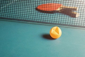 Copy Space and Soft focus at broken ping pong ball on the table tennis / Soft light background with...