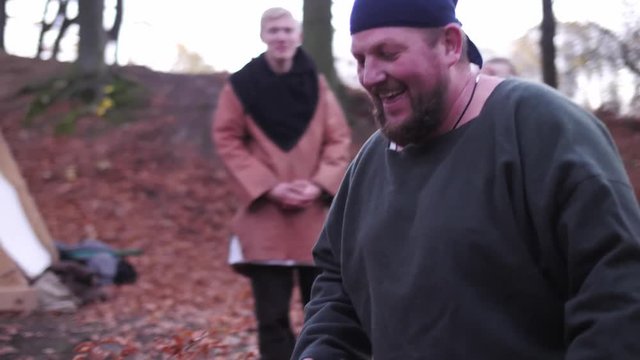 Vikings have some fun. Viking play with egg, bringing eggs on a sword