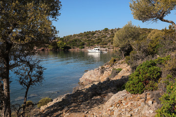 Summer time a beautiful yacht anchoring in Love bay Poros island Greece. © VictoriaKurylo
