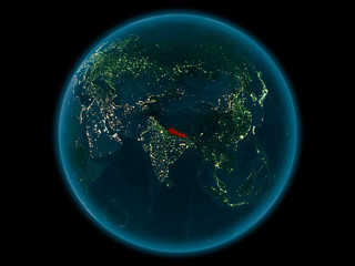 Nepal on planet Earth in space at night