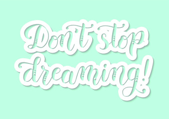 Handwritten modern calligraphy of motivational phrase Don't stop dreaming in violet and pink on white background in paper cut style for poster, motto, slogan, postcard, sticker, title, decoration