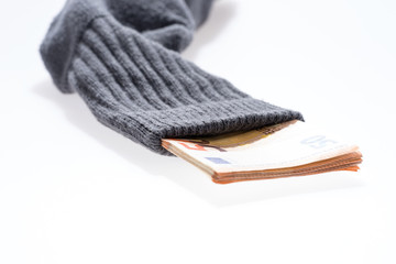 Euro banknotes in an dark sock isolated on white with room for copy space