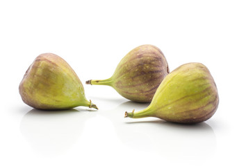 Three figs purple green isolated on white background ripe fresh.