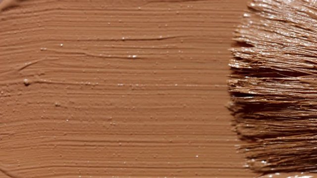liquid foundation texture smudge with brush. Makeup base closeup texture