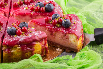 Berry cheesecake with berry sauce and fresh berries