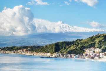 Panoramic view of Giardini Naxos with the Mount Etna. View from Taormina. Province of Messina. Sicily, Italy. - obrazy, fototapety, plakaty