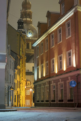 Riga Old town in winter covered with snow. Historical buildings, popular landmarks, authentic architecture. Small streets with cobblestone.