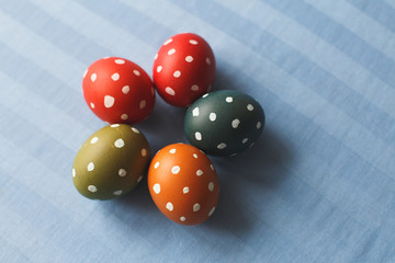 Easter eggs with dots on blue textil background