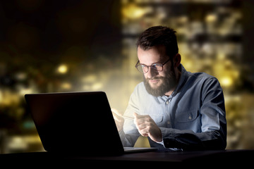 Businessman in the office at night
