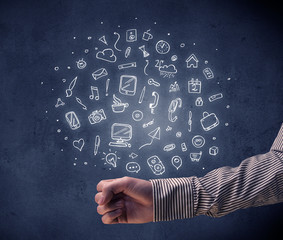 Hand holding mixed drawings