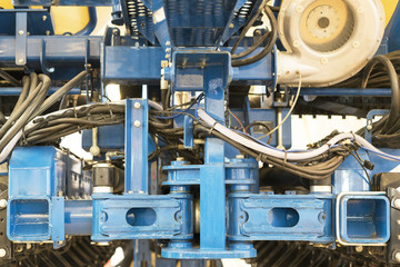 Close up of chain on gear on agricultural machine
