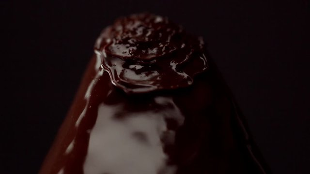 blowing with hot air on strawberry covered by chocolate, Chnging of chocolate texture macro
