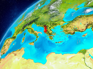 Space view of Albania in red